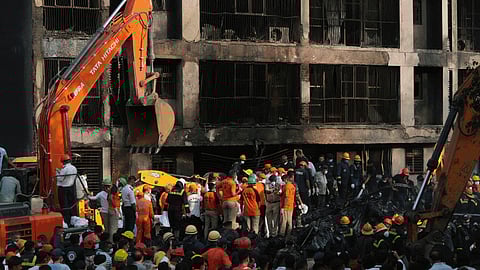 Search and recovery teams work through the rubble of a plane crash in Ahmedabad, India.