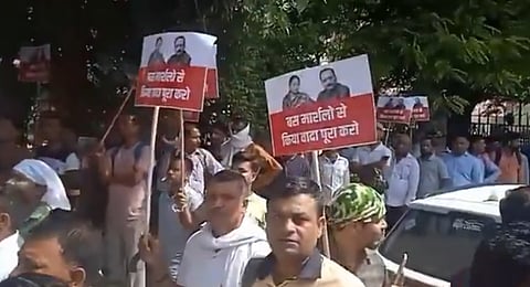 Civil defence volunteers protest outside Delhi CM Rekha Gupta's residence on Wednesday.