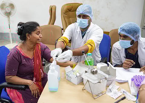 A relative of yesterday's Air India plane crash victim gives her DNA sample for identification of bodies at a hospital, in Ahmedabad, Friday, June 13, 2025.