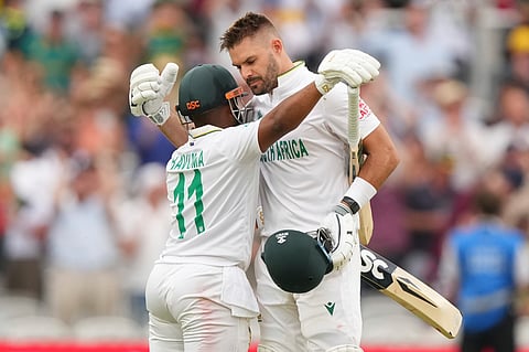 South Africa's Aiden Markram celebrates his century with Temba Bavuma