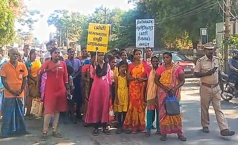 Irular families protesting outside the government school in Sriperumbudur demanding action against the principal