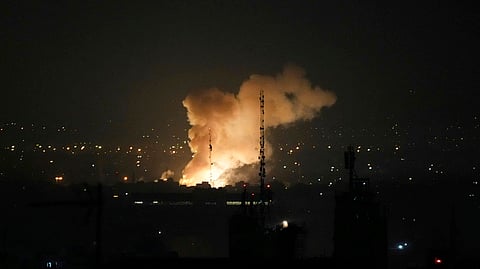 Smoke rises up after an explosion in Tehran, Iran, Friday, June 13, 2025.