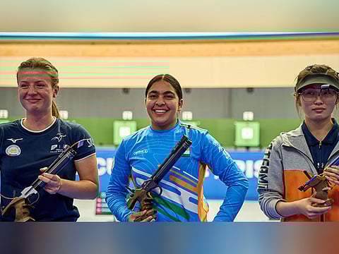 Suruchi Singh (c) after claiming the top prize during the ISSF World Cup in Munich