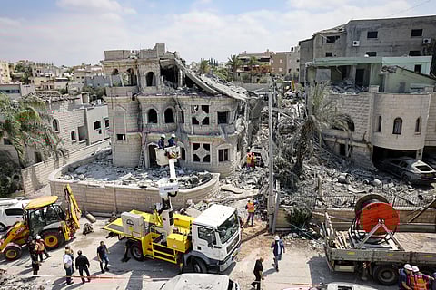 Rescue teams clear rubble in a neighbourhood in the northern Israeli town of Tamra, following an overnigh missile attack from Iran on June 15, 2025, where four people, including a child, were reported killed.