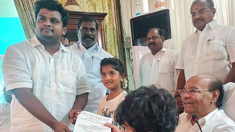 PMK Ramadoss is issuing an appointment letter to Murali Shankar.