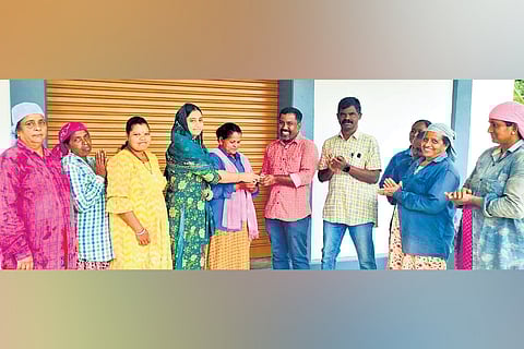 Ward member Jisra handing over ring to Antony in presence of MGNREGA workers