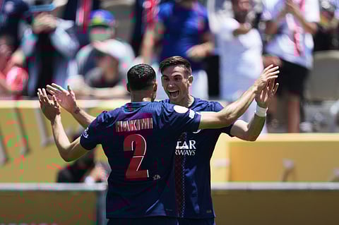 Paris Saint-Germain's Fabian Ruiz, right, celebrates after scoring the opening goal with teammate Achraf Hakimi during the Club World Cup group B soccer match between PSG and Atletico Madrid in Pasadena, Calif., Sunday, June 15, 2025.