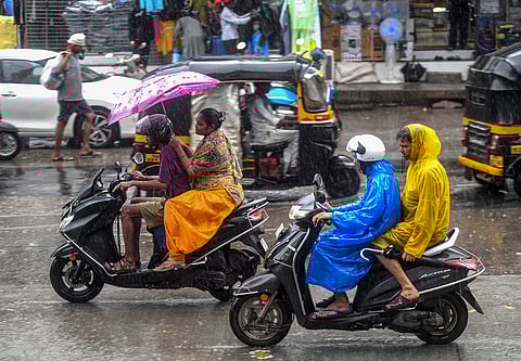 People commute amid rains, in Mumbai, Monday, June 16, 2025.