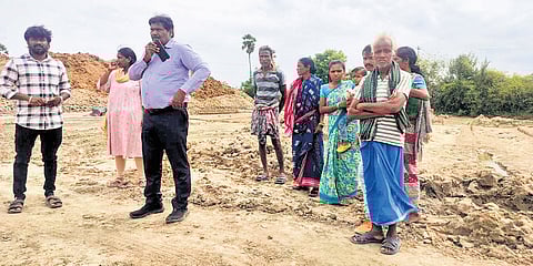 Officials with the rescued bonded workers from Odisha on Tuesday