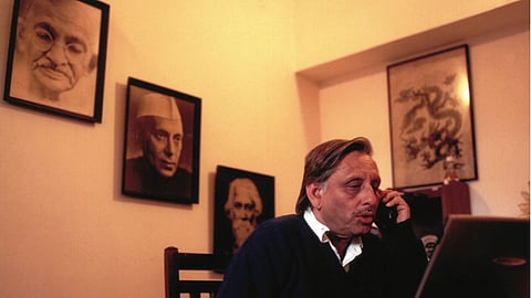 In his MP’s office with portraits of Gandhi, Nehru and Tagore, hanging at his back, 2001-04