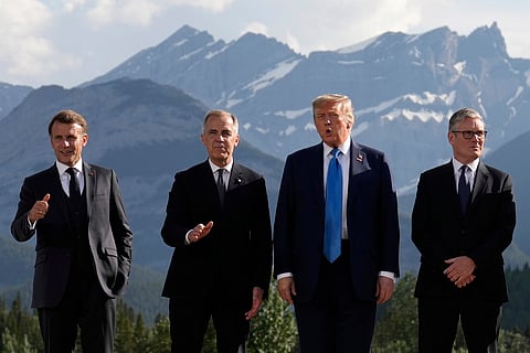 France's President Emmanuel Macron, Canada's Prime Minister Mark Carney, President Donald Trump and Britain's Prime Minister Keir Starmer, arrive for a group photo at the G7 Summit, Monday, June 16, 2025, in Kananaskis, Canada.