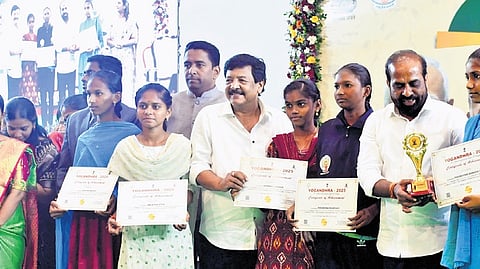 Ministers Satya Kumar & Durgesh present awards to winners in yoga contest in Vijayawada on Wednesday.
