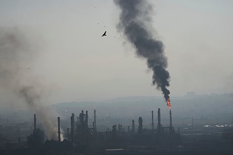 Smoke billows after an Iranian missile struck an oil refinery in Haifa, northern Israel