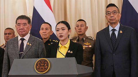 Thailand's Prime Minister Paetongtarn Shinawatra, center, talks to reporters at Government House in Bangkok, Thailand, Thursday, June 19, 2025.