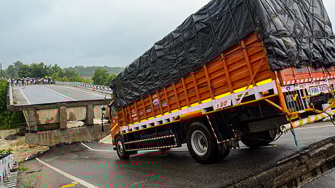 A truck stuck at a bridge on the Banai river after a portion of the bridge collapsed due to heavy rainfall at Torpa, blocking the Khunti-Simdega road, in Khunti district, Jharkhand