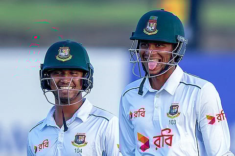 Bangladesh's Nahid Rana (R) and Hasan Mahmud react as they walk back to the pavilion at the end of the second day of the first Test cricket match between Sri Lanka and Bangladesh at the Galle International Cricket Stadium in Galle on June 18, 2025.