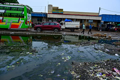 While diarrhoea spreading fast in the city, garbages seen lying in stagnant water at Baramunda old bus depot in Bhubaneswar on Wednesday.