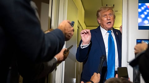 US President Donald Trump speaks with reporters while flying aboard Air Force One, June 16, 2025.