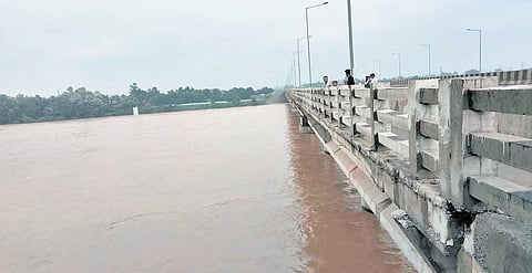 Water flows at a touching distance of Brahmani bridge at Rourkela on Friday.