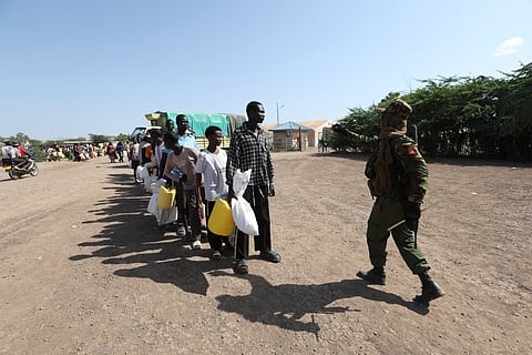 Refugees waiting in a queue to receive humanitarian aid distributed by the World Food Programme (WFP) at Kakuma Refugee Camp in Turkana, Kenya, Wednesday, June 4, 2025.