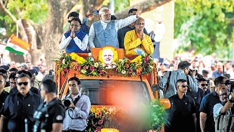 PM Narendra Modi holds a roadshow before joining the public meeting on completion of one year of BJP government in Odisha.