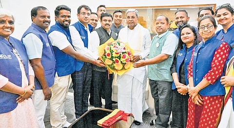 Kannadigas who returned to Bengaluru from Israel meet Chief Minister Siddaramaiah at his official residence on Friday.