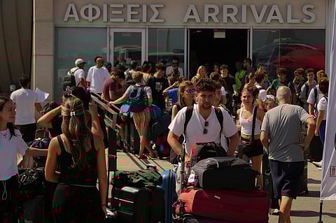 Evacuees from Israel arrive at Cyprus' main port of Limassol aboard the cruise ship Crown Iris, on Saturday, June 21, 2025.