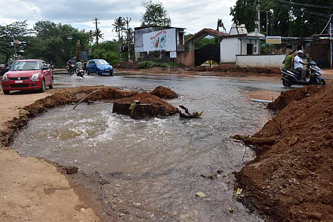 Water gushes out from a broken drinking water pipeline at Kalampalayam on Siruvani Main Road in Coimbatore district, after it was damaged during excavation work for road expansion by the Highways Department.