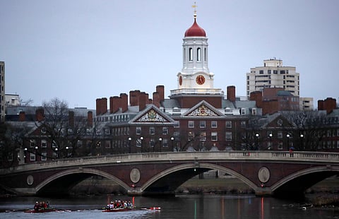 Rowers paddle down the Charles River near the campus of Harvard University in Cambridge, Mass., March 7, 2017.