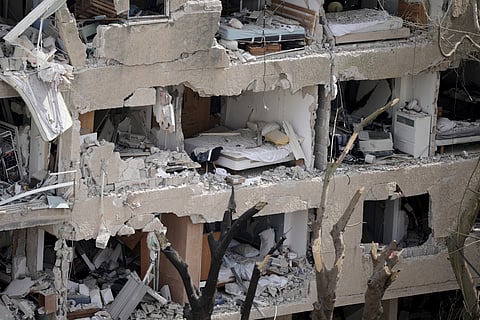 Shattered rooms are seen in an apartment building at the site of a direct missile strike launched from Iran in Tel Aviv, Israel, Sunday, June 22, 2025.