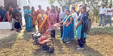 A shareholder of Prachi farmer producer organisation demonstrating tilling with the help of a power tiller machine.