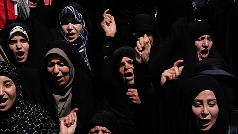 Women chant slogans during a protest to condemn Israeli attacks on multiple cities across Iran, after attending a Friday prayers ceremony in Tehran, Iran, Friday, June 20, 2025