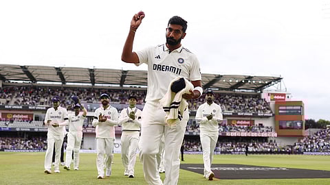Jasprit Bumrah leads the Indian team off the field after taking five wickets in the first innings on day three