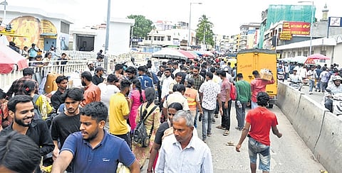 The junction near Chickpet Metro Station witnesses severe traffic congestion with thousands of people and vehicles passing every hour.