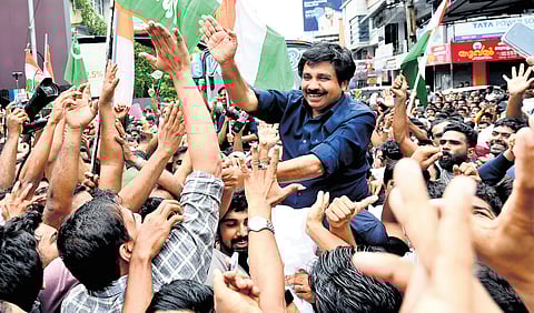 UDF’s Aryadan Shoukath greets jubilant supporters gathered in Nilambur town after his victory in the by-election on Monday