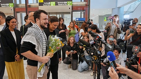 Mahmoud Khalil, second from left, alongside Rep. Alexandria Ocasio-Cortez, prepares to speak at a news conference upon arriving at Newark International Airport, Saturday, June 21, 2025, in Newark, N.J.
