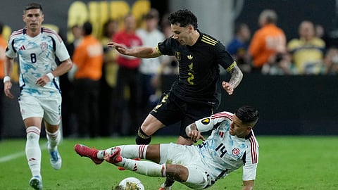 Costa Rica's Orlando Galo tackles Mexico's Jorge Sanchez during a CONCACAF Gold Cup soccer match Sunday, June 22, 2025, in Las Vegas.