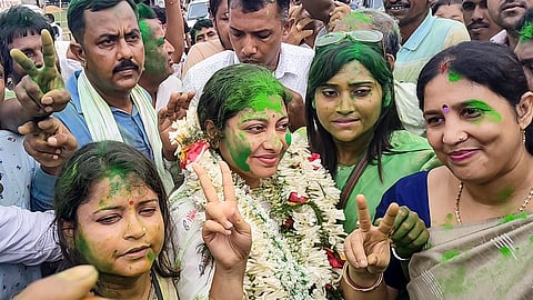 TMC candidate Alifa Ahmed flashes victory sign after winning the Kaliganj Assembly constituency by-election, in Nadia, West Bengal, Monday, June 23, 2025.