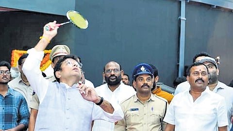 IT & Industries Minister D Sridhar Babu looks to hit a shuttlecock after inaugurating the SLV Pro Badminton Stadium at Samathanagar, Nizampet, on Tuesday