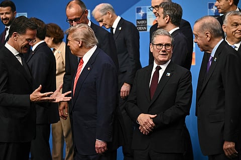 NATO Secretary General Mark Rutte, from left, President Donald Trump, Britain's Prime Minister Keir Starmer and Turkey's President Recep Tayyip Erdogan gather with NATO country leaders for a family photo during the NATO summit in The Hague, Netherlands, Wednesday, June 25, 2025.