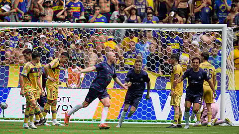 Auckland City's Christian Gray, center left, celebrates after scoring his side's opening goal during the Club World Cup Group C soccer match between Auckland City and Boca Juniors in Nashville, Tenn., Tuesday, June 24, 2025.