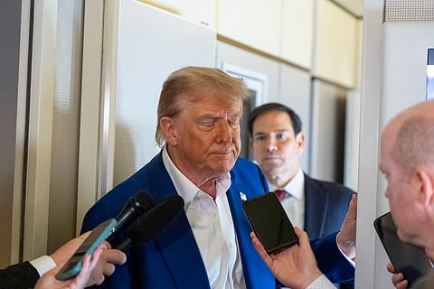 President Donald Trump turns to depart after speaking with reporters on Air Force One while in flight from Joint Base Andrews, Md., to Amsterdam, Netherlands, Tuesday, June 24, 2025.