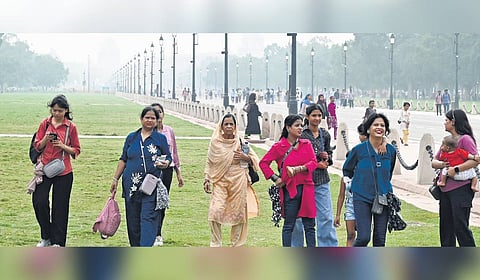 People on an outing during a hot and humid day at Kartvya Path in New Delhi on Wednesday