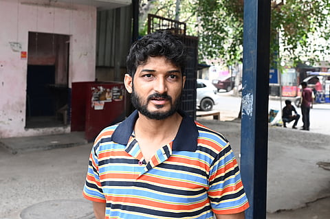 Dharam Singh, son of Dilip Singh, who was killed in a massive fire that broke out in a polythene factory near Delhis Rithala Metro station, Waits outside Buddhvihar Police station to receive body in New Delhi on June 25, 2025.