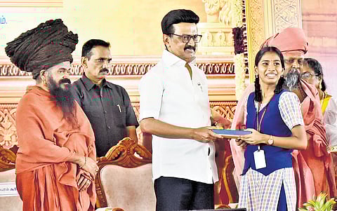 Chief Minister MK Stalin distributing the financial aid to the students at a function at Arulmigu Ekambaranathar matriculation school;