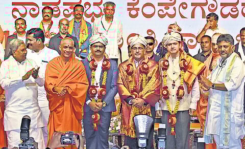 CM Siddaramaiah and DCM DK Shivakumar along with seers of various mutts felicitate Indian Institute of Science’s Kaushal Verma, KIA MD Hari Marar and MSIL Director Prasanth PK.