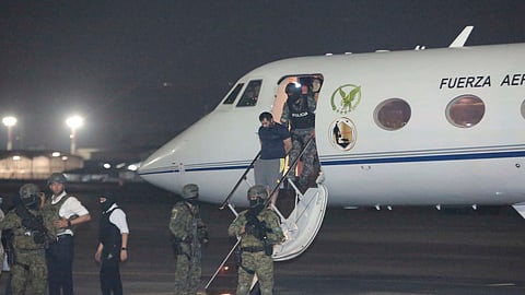 Escorted by soldiers and police officers, Adolfo "Fito" Macias, the leader of the Choneros gang, arrives in Guayaquil, Ecuador, after getting detained, Wednesday, June 25, 2025.