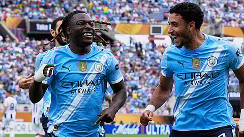 Manchester City's Jeremy Doku, left, celebrates after scoring the opening goal during the Club World Cup Group G soccer match between Juventus and Manchester City on June 26, 2025.