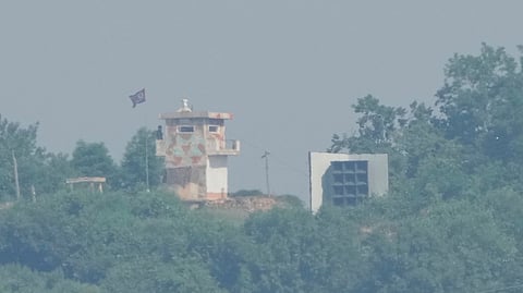 A North Korean military guard post, left, and loudspeaker are seen from Paju, South Korea, near the border with North Korea, June 12, 2025