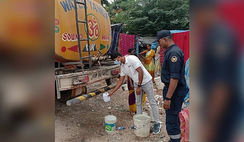 HYDRAA officials collect samples to check the quality of water from Sunnam Cheruvu